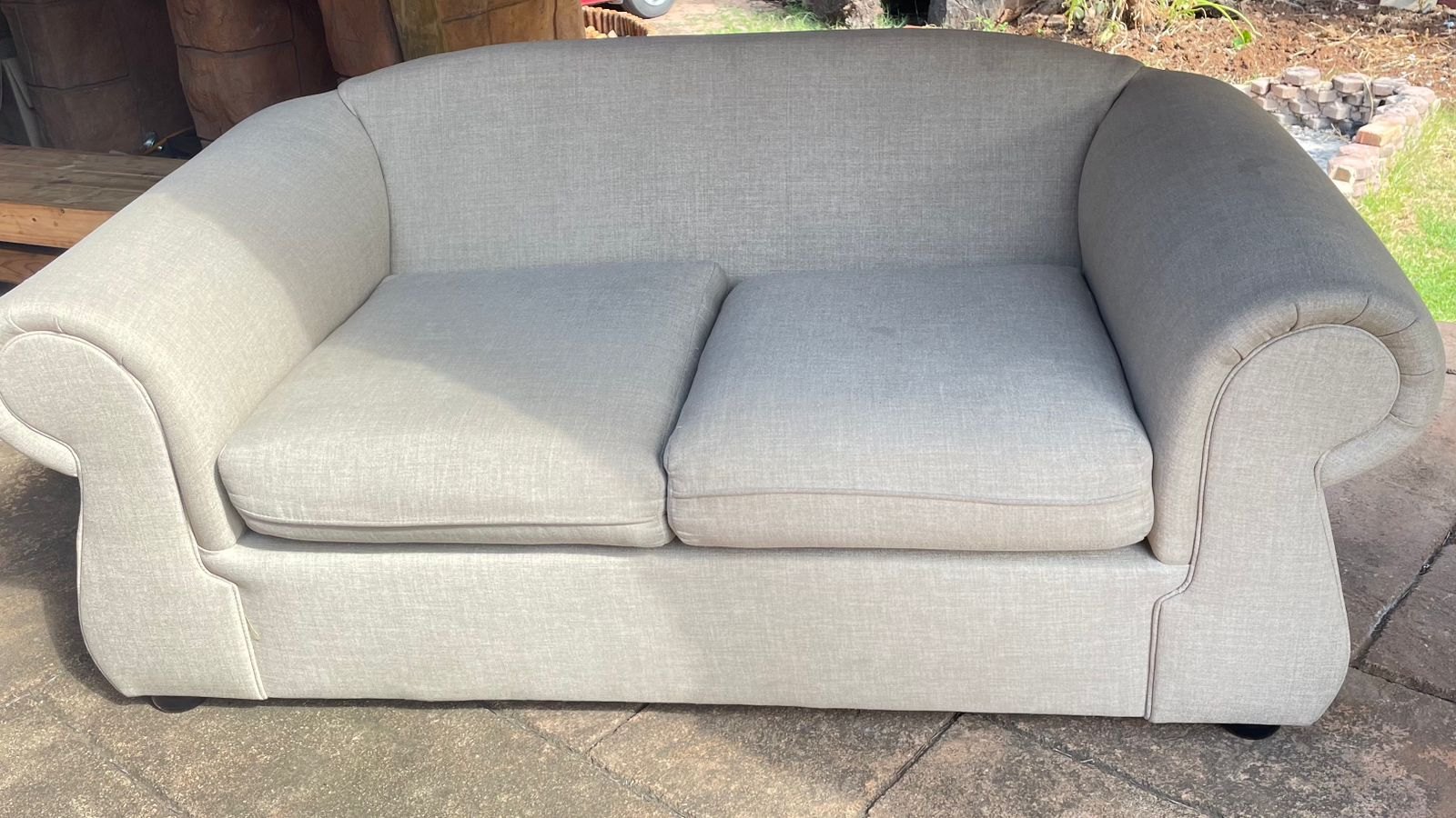 Cream two-seater sofa after cleaning and fabric protection